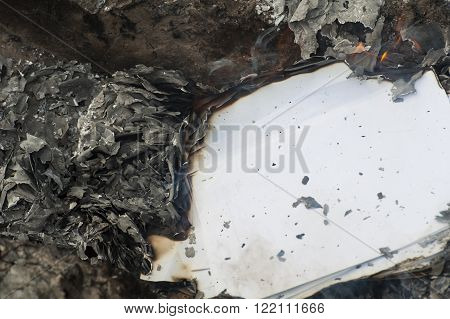 Burning office white paper in bonfire outside
