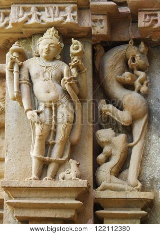 Stone carved erotic bas relief in Hindu temple in Khajuraho India. Unesco World Heritage Site