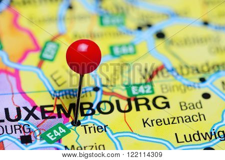 Photo of pinned Trier on a map of Germany. May be used as illustration for traveling theme.