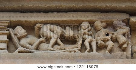 Stone carved erotic bas relief in Hindu temple in Khajuraho India. Unesco World Heritage Site