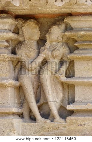 Stone carved erotic bas relief in Hindu temple in Khajuraho India. Unesco World Heritage Site
