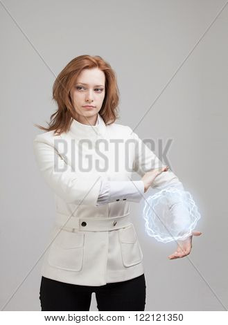 Woman with glowing magical energy ball.