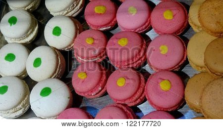 Macarons sweets in showcase at the confectionery shop