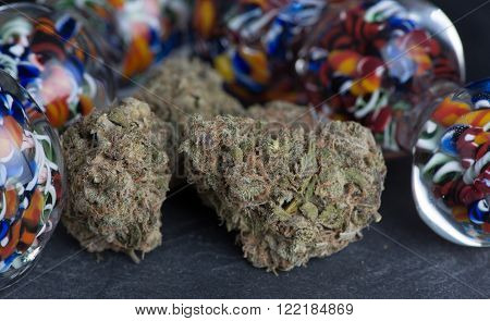Granddaddy Purple medicinal medicinal marijuana close up of buds surrounded by colorful glass.
** Note: Soft Focus at 100%, best at smaller sizes