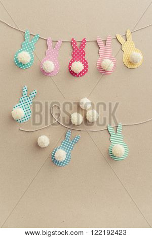 Easter Bunny Banner. Cute bunny shapes with yarn pom pom tails.