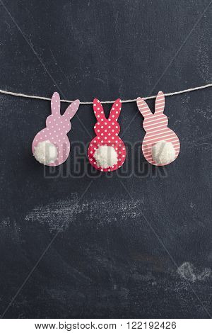 Easter Bunny Banner. Cute bunny shapes with yarn pom pom tails.