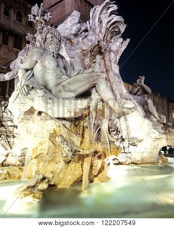 ROME, ITALY - SEPTEMBER 14, 1992 - Fontana dei Quattro Fiumi (Four Rivers fountain) in the Piazza Navona floodlit at night Rome Italy Europe, September 14, 1992.