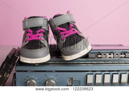 portrait in 80's style of a little child sneakers shoes