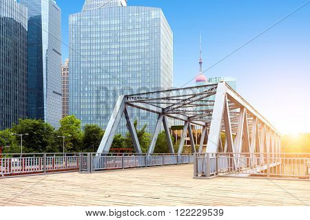 Shanghai China skyscrapers and old iron bridge.