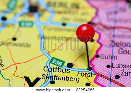 Photo of pinned Forst on a map of Germany. May be used as illustration for traveling theme.