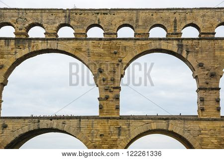 Pont du Gard, in Provence, France, over the Gardon river, is an 160 foot high roman aqueduct built to provide water to the city of Nimes from the river Eure near Uzes, in the first century A.D.