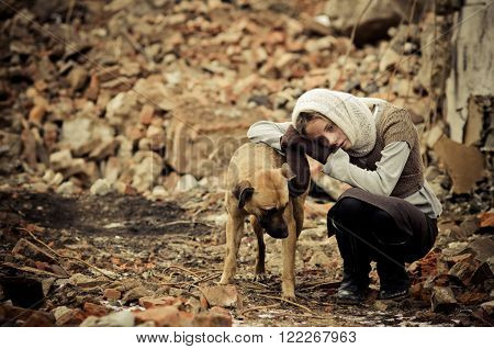 Young Girl Dressed In The Poor Sweater And Scarf