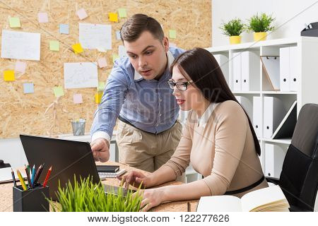 Woman And Man Discussing Project