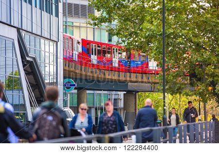 LONDON, UK - SEPTEMBER 17, 2015: People at the DLR station, light train railway of London