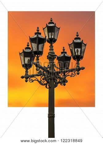 old city street lamp with a background as an abstract sunset