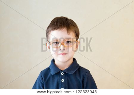 Portrait of a boy with glasses. Ophthalmology. Vision.
