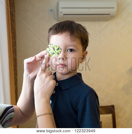 Eye patch. Portrait of a boy. Ophthalmology.