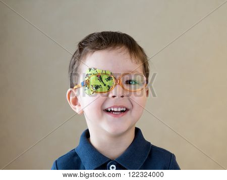 Eye patch. Portrait of a boy. Ophthalmology.