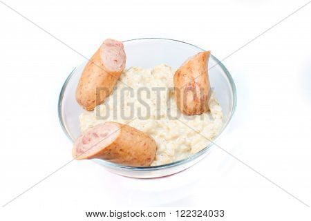 Oatmeal with grilled sausages. Breakfast. Healthy food.