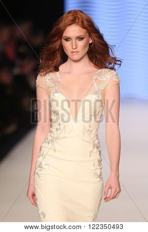 ISTANBUL, TURKEY - MARCH 16, 2016: A model showcases one of the latest creations of Rasit Bagzibagli Couture Catwalk in Mercedes-Benz Fashion Week Istanbul