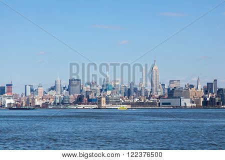 JERSEY CITY NJ - MARCH 6: A view of Midtown Manhattan featuring the Empire State Building and 432 Park as seen from Liberty State Park on March 6 2016.