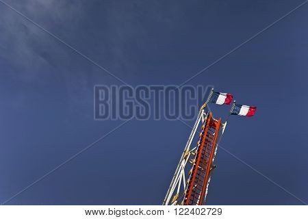 High ride and French flags in a fairgound