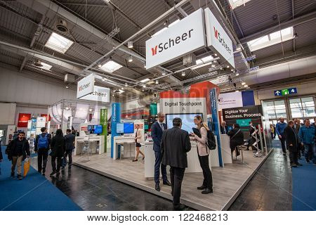 HANNOVER GERMANY - MARCH 14 2016: Booth of Scheer company at CeBIT information technology trade show in Hannover Germany on March 14 2016.