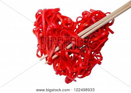 cooked red pasta arranged in a heart shape. red heart-shaped spaghetti and chopsticks, symbolizing the arrow pierces the heart. isolated on white background