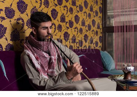 Muslim Man Smoking Shisha At Arabic Restaurant - Exhaling Smoke