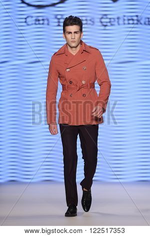 ISTANBUL, TURKEY - MARCH 17, 2016: A model showcases one of the latest creations of Can Yunus Cetinkaya in Mercedes-Benz Fashion Week Istanbul