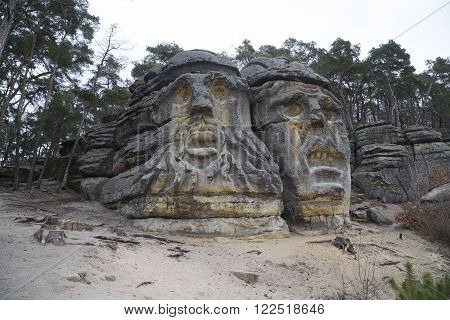 Giant stone devil's heads by the village Zelizy in the Czech republic Europe