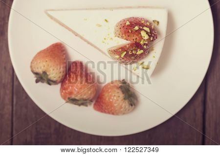Close Up Of Strawberry Cream Cake On White On The Wood Background, Vintage Toning