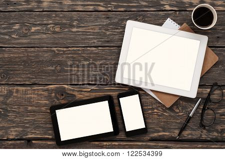 On the desktop various devices with blank screen, top view