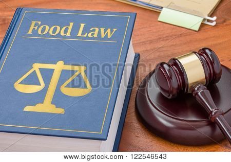 A law book with a gavel - Food law