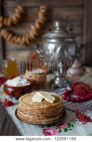 Traditional homemade slapjacks with butter, honey, milk and cottage cheese on vintage wooden table background