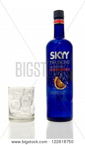 Winneconne WI - 15 March 2016: A bottle of Skyy Infusions blood orange vodka with a glass of ice