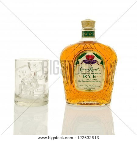 Winneconne WI - 19 March 2016: A bottle of Crown Royal rye with a glass of ice.