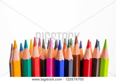 color pencils of various colors standing in a dozen