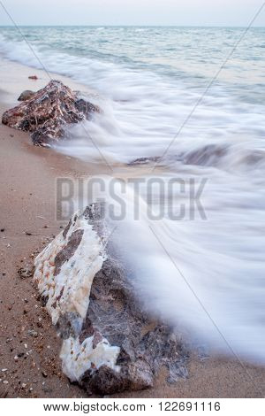 Rocks in the ocean wave Hua Hin Thailand. Long exposure photography.