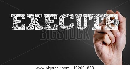 Hand writing the text: Execute