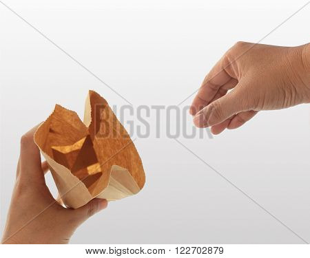 Hand Holding A Brown Paper Bag For Pick
