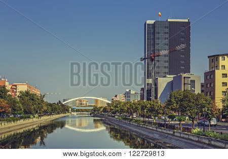 Bucharest, Romania - August 14, 2013: Picturesque city view with Dambovita river passing through Grozavesti district.