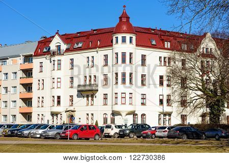 Kalmar Sweden - March 17 2016: The architecture along Vegagatan with cars parked along the street.