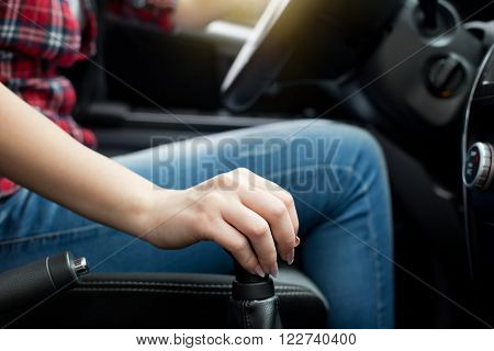 Woman Shifting Gears In The Car