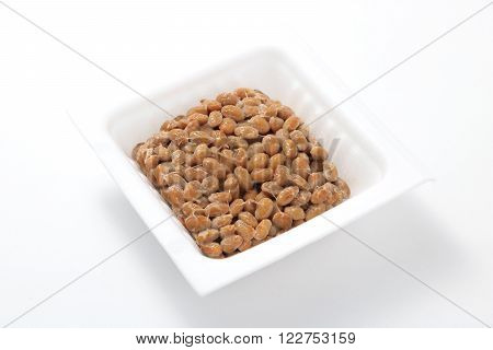 Natto, fermented soybeans on white background. (Japanese food)