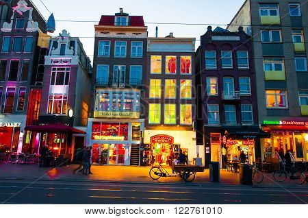 AMSTERDAM-APRIL 27: Rokin street during the night on April 272015 in Amsterdam. Rokin is a major street in Amsterdam the Netherlands.