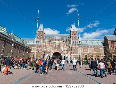 AMSTERDAM-APRIL 27: The Rijksmuseum on King's Day people walk to a public space (Museumplein) on April 27 2015. The Rijksmuseum is a Netherlands national museum dedicated to arts and history.