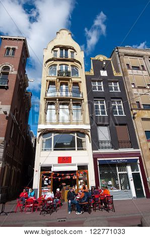 AMSTERDAMNETHERLANDS-APRIL 27: Local outside restaurant on the Rokin street during King's Day on April 272015 in Amsterdam the Netherlands.