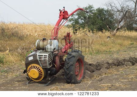DIKANKA UKRAINE - SEPTEMBER 30 2015: Plowing garden tractor motor-block Motor Sich MB-405