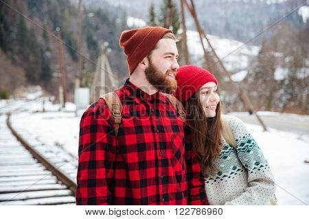 Happy couple looking at something outdoors